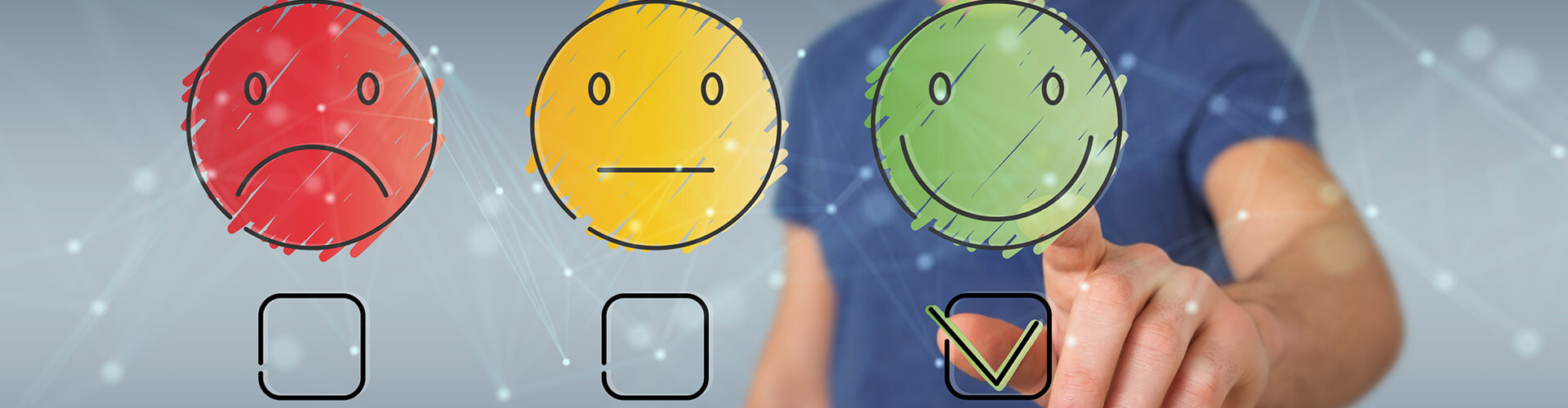 Finger zeigt auf einen grünen Smiley
